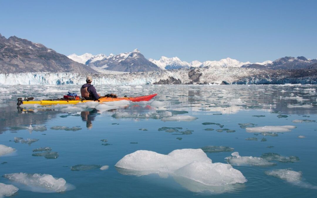 Kayak Among Massive Icebergs At Kennicott Glacial Lake