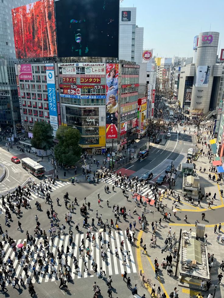 Crowds crossing the famous Shibuya Crossing in Tokyo.
