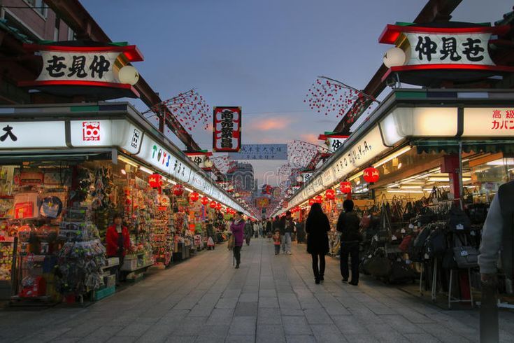 Vistors exploring Nakamise Shopping Street near the temple.